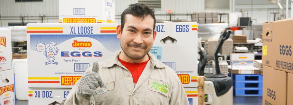 man smiling giving thumbs up