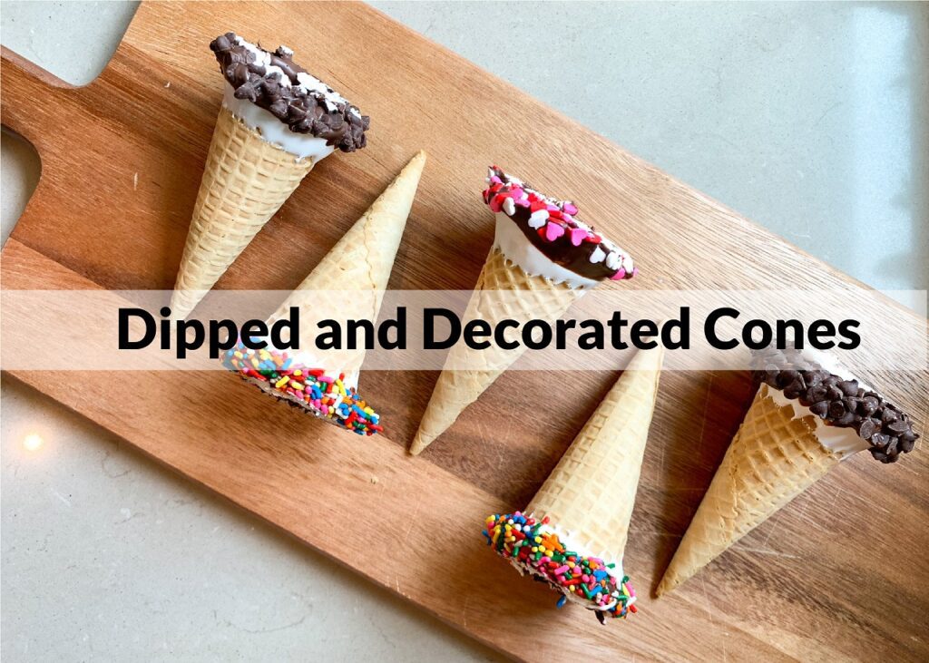 decorated ice cream cones lined on a cutting board