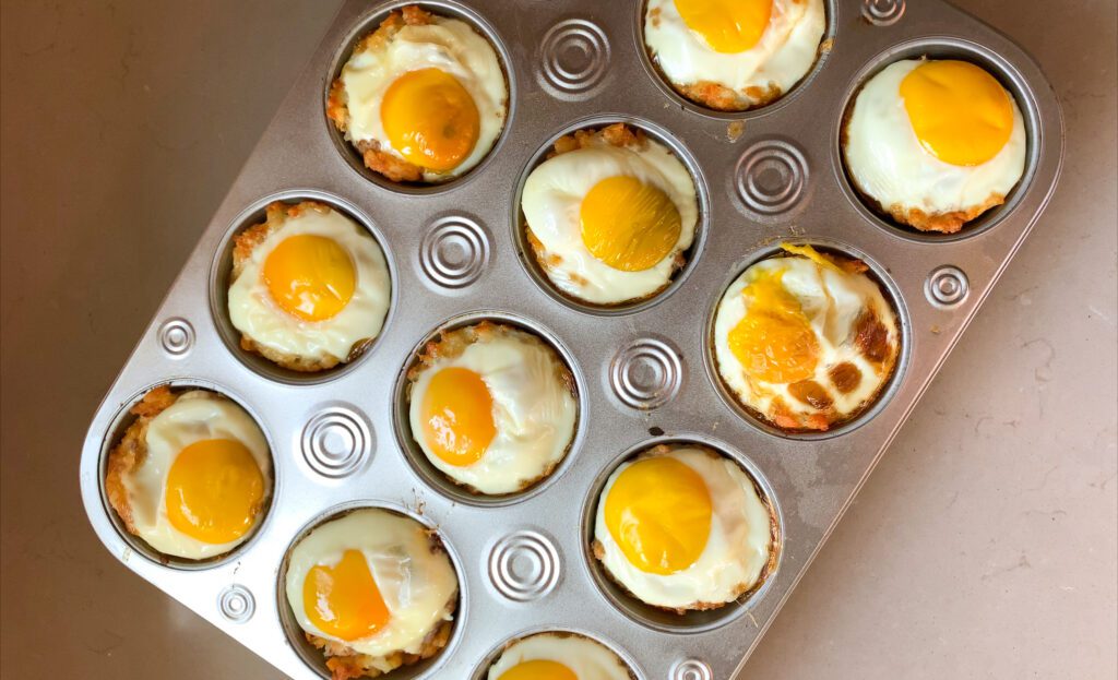 baked breakfast tot cups in muffin tin